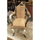 A cow horn and leather elbow chair