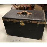 A 19th Century French canvas covered and leather embellished trunk with brass lock plate and clips