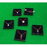 Six various nine carat gold mounted pendants each with various stone,
