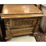 A circa 1900 Continental oak dwarf cupboard with fall-front compartment over a single drawer on