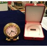 A Cartier travel clock, 24 carat plated,