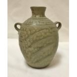 PHIL ROGERS (Born 1951) - a twin handled stoneware vase with incised decoration,