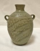 PHIL ROGERS (Born 1951) - a twin handled stoneware vase with incised decoration,