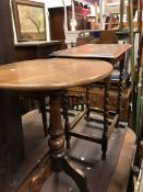 An early 20th Century oak framed footstool together with an oak occasional table and a mahogany