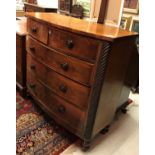 A Victorian mahogany bow fronted chest of two short over three long graduated drawers flanked by