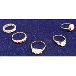 A collection of five various gold stone set dress rings,