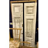A pair of painted hardwood doors with fielded panels,