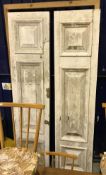 A pair of painted hardwood doors with fielded panels,