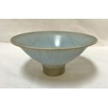 DAVID WHITE (1934-2011) - a studio porcelain bowl with footed base and blue crackle glaze,