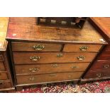 An 18th Century oak chest the plain top with applied edging over two short and three long drawers