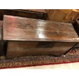 An 18th Century oak hutch with moulded and notch carved decoration raised on bracket feet