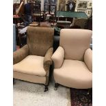 A circa 1900 upholstered scroll arm chair together with a similar ladies chair