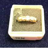 An 18 carat gold and five stone set diamond ring approx.