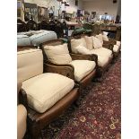 An early to mid 20th Century stained beech framed Bergere five piece suite comprising two seat sofa