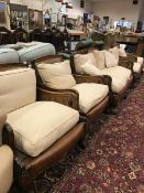 An early to mid 20th Century stained beech framed Bergere five piece suite comprising two seat sofa