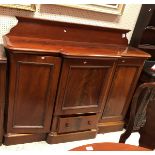 A Victorian mahogany break front sideboard of slim proportions with the raised back over a central