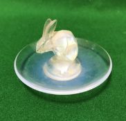 A Lalique opalescent glass pin dish with central rabbit decoration