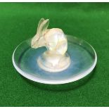 A Lalique opalescent glass pin dish with central rabbit decoration