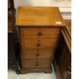 A circa 1900 mahogany and inlaid chest of small proportions the plain top above four drawers