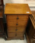 A circa 1900 mahogany and inlaid chest of small proportions the plain top above four drawers