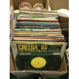 A box containing various mainly twelve inch singles,