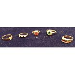 A collection of five gold stone set rings,
