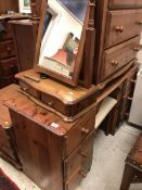 A modern pine kneehole dressing table and separate dressing mirror,