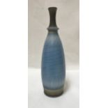 DAVID WHITE (1934-2011) - a narrow necked bottle with blue crackled glaze,