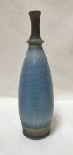 DAVID WHITE (1934-2011) - a narrow necked bottle with blue crackled glaze,