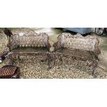 A pair of 19th Century painted cast iron garden seats with horseshoe style design to back and