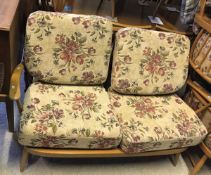 An Ercol "Windsor" beech framed two seat sofa, circa 1966,