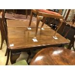 An Edwardian mahogany rectangular extending dining table on cabriole legs to claw and ball feet