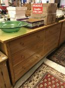 A pair of modern light oak chests of six drawers together with two oak bedside cabinets