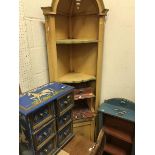 A modern painted corner cupboard together with a similar painted three tier bookcase,