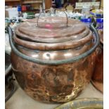 A Victorian copper cauldron and cover with iron swing handle