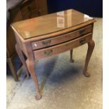 A mid 20th Century mahogany bow fronted two drawer canteen table with baize lined interior on