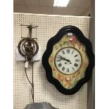 A 19th Century French wall clock within an ebonised frame with painted dial and chapter ring with