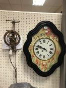 A 19th Century French wall clock within an ebonised frame with painted dial and chapter ring with