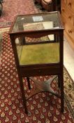 An Edwardian mahogany bijouterie table of square form raised on square supports united by an