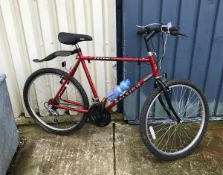 A Raleigh Jackal mountain bike in red