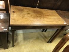 A George III mahogany fold over card table of rectangular form,