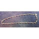 A 9 carat gold hermatite and amethyst necklace, approx 14.