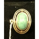A 9 carat gold dress ring set with oval turquoise, approx 6.
