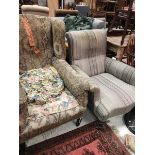 A circa 1900 upholstered wingback armchair together with a Victorian upholstered armchair