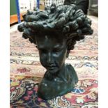 ROLAND MOLL "Callissa" a bronzed cold cast bust of a child with flowing hair,