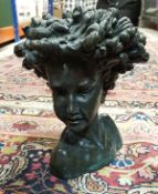 ROLAND MOLL "Callissa" a bronzed cold cast bust of a child with flowing hair,