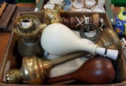 A box containing various brass and pottery table lamps