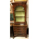 A walnut and inlaid cabinet on chest in the 18th Century style the single glazed door enclosing two