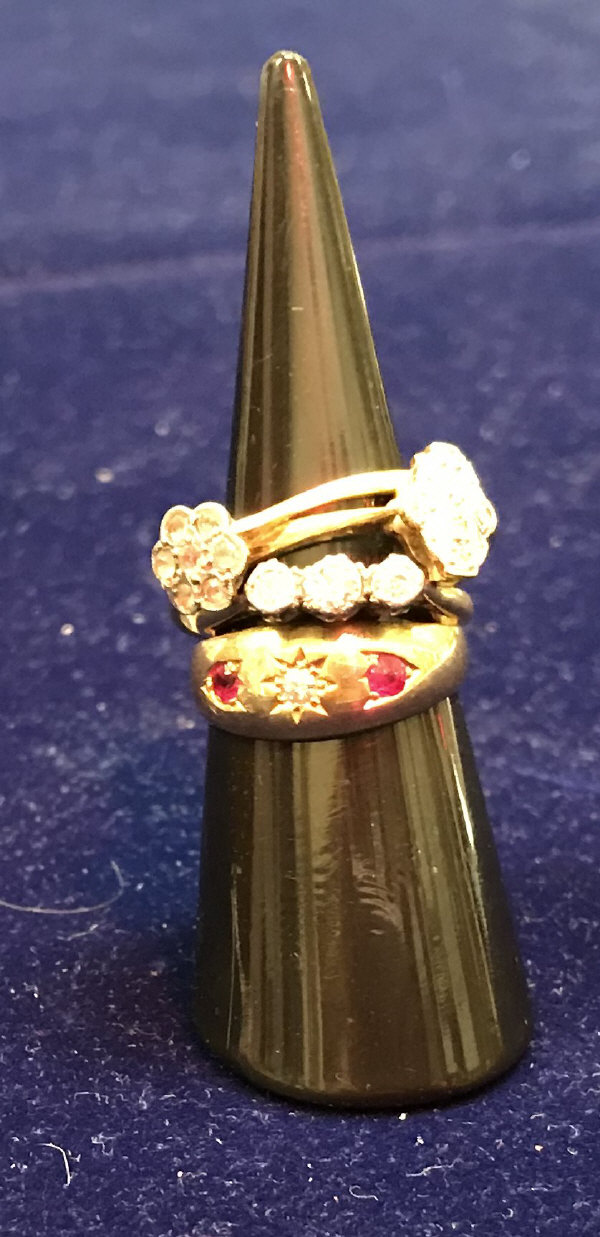 A collection of four 18 carat gold and diamond and other stone set dress rings approx.
