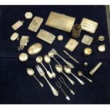 A collection of silver wares to include vesta cases, sovereign holder, cigarette case, cutlery, etc,